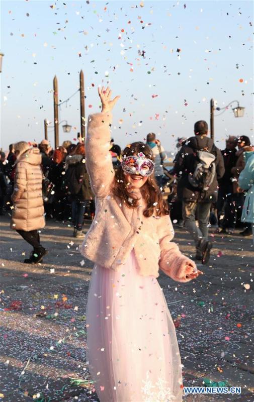 A reveler dances during the Venice Carnival in Venice, Italy, on Feb. 17, 2019. The Venice Carnival 2019 kicked off on Saturday and will last until March 5. (Xinhua/Cheng Tingting)