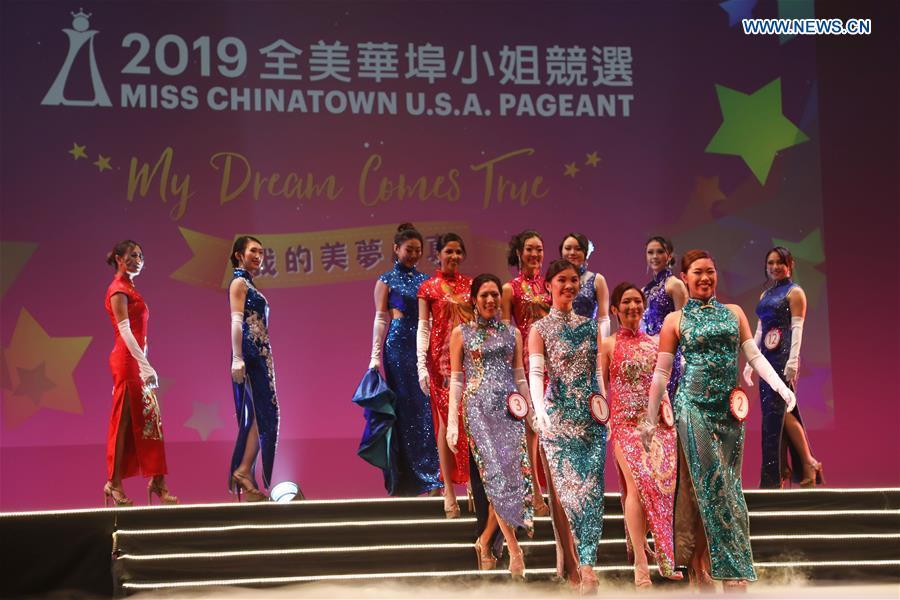 Contestants compete in the evening dress session during the final of the 2019 Miss Chinatown U.S.A. Pageant in San Francisco, the United States, Feb. 16, 2019. A total of 12 contestants took part in the final competition organized by San Francisco Chinese Chamber of Commerce. (Xinhua/Liu Yilin)