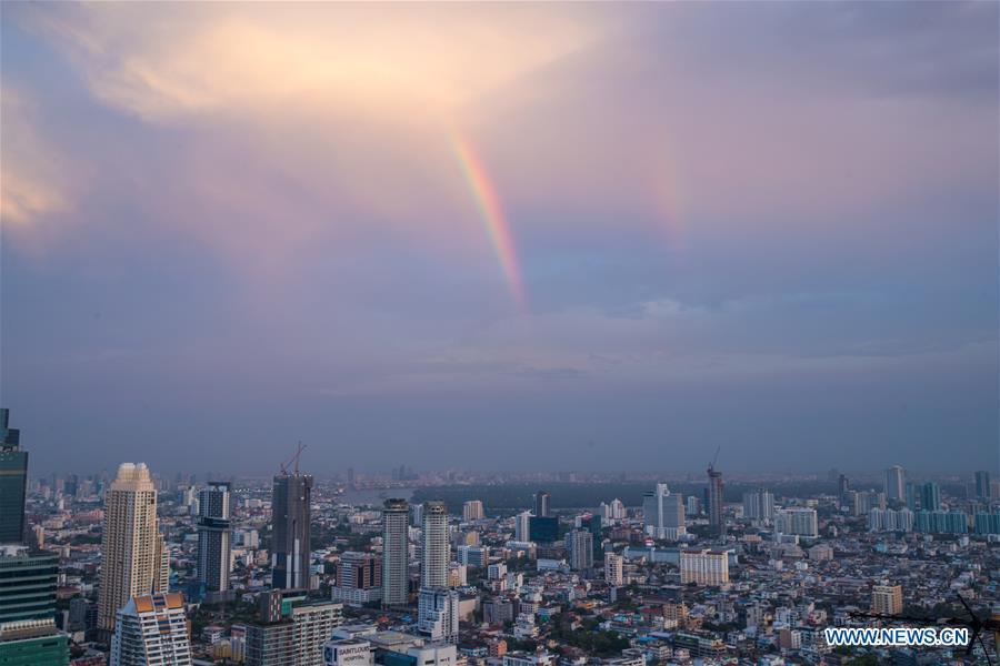 A rainbow appears in the sky after rainfall in Bangkok, Thailand, Feb. 17, 2019. The rainfall helped to improve the air quality in Bangkok. (Xinhua/Zhang Keren)