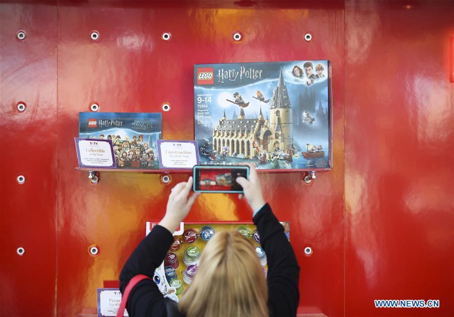A visitor takes photo of an awarded toy product at the 116th Annual North American International Toy Fair at the Jacob K. Javits Convention Center in New York, the United States, Feb. 16, 2019. The toy fair, held from February 16 to 19 this year, gathered more than 1,000 toy exhibitors and hundreds of thousands of toys and youth entertainment products to retail outlets and trade guests from over 100 countries and regions. (Xinhua/Wang Ying)