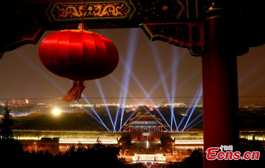 The Palace Museum is lit up on Feb. 18 evening for a rehearsal of rare nighttime public tours on Feb. 19 and Feb. 20 for visitors who were able to snag the free tickets. (Photo: China News Service/Du Yang)