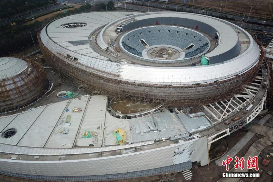 An aerial photo shows the Shanghai Planetarium on Feb. 20, 2019. All of the main steel structure projects of the Shanghai Planetarium were completed on Tuesday. Located in Lingang in Pudong New Area, the Shanghai Planetarium will be the world\'s largest with a total area of 38,164 square meters when it officially opens in 2020. The main idea behind the design of the planetarium is influenced by astronomical principles like orbital motion. (Photo: China News Service/Zhang Hengwei)