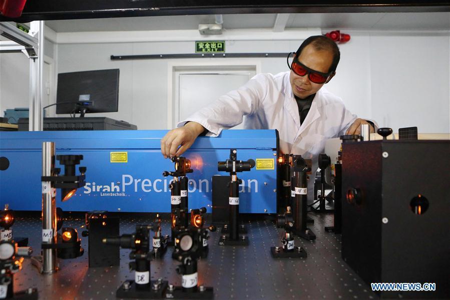 Huang Wentao, head of a fluorescence Doppler lidar system installation project and a member of China\'s 35th research mission in Antarctica, adjusts equipments at the Zhongshan Station, a Chinese research base in Antarctica, Feb. 11, 2019. Chinese researchers have installed and tested a fluorescence Doppler lidar system at a research base in Antarctica during a mission that was just concluded last week and are now heading home. The system run at Zhongshan Station had enabled them to simultaneously observe the temperature and the three-dimensional wind field in the atmospheric region mesopause above Antarctica, exploring the middle and upper atmosphere of the polar cusp region. (Xinhua/Liu Shiping)