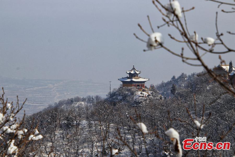 A view of the snow-covered Kongtong Mountain, one of the sacred mountains of Taoism, in Pingliang City, Gansu Province in mid-February. The spot is noted for its marvelous natural scenery and is referred to as \