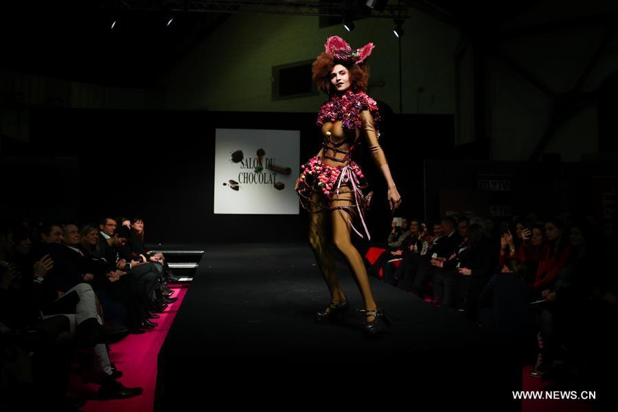 A model displays a chocolate dress during the opening show of the 6th Brussels Chocolate Salon in Brussels, Belgium, Feb. 21, 2019. The 6th Brussels Chocolate Salon (Salon du Chocolat Brussels) kicked off here on Thursday. In the following three days, 130 chocolatiers, pastry chefs, confectioners, designers and cocoa experts of international reputation in attendance will share and exhibit chocolate in all its delectable forms. (Xinhua/Zheng Huansong)