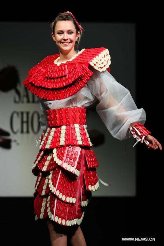 A model displays a chocolate dress during the opening show of the 6th Brussels Chocolate Salon in Brussels, Belgium, Feb. 21, 2019. The 6th Brussels Chocolate Salon (Salon du Chocolat Brussels) kicked off here on Thursday. In the following three days, 130 chocolatiers, pastry chefs, confectioners, designers and cocoa experts of international reputation in attendance will share and exhibit chocolate in all its delectable forms. (Xinhua/Zheng Huansong)