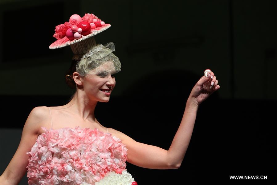 A model displays a chocolate dress during the opening show of the 6th Brussels Chocolate Salon in Brussels, Belgium, Feb. 21, 2019. The 6th Brussels Chocolate Salon (Salon du Chocolat Brussels) kicked off here on Thursday. In the following three days, 130 chocolatiers, pastry chefs, confectioners, designers and cocoa experts of international reputation in attendance will share and exhibit chocolate in all its delectable forms. (Xinhua/Zheng Huansong)