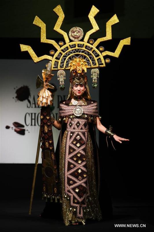A model displays a chocolate dress during the opening show of the 6th Brussels Chocolate Salon in Brussels, Belgium, Feb. 21, 2019. The 6th Brussels Chocolate Salon (Salon du Chocolat Brussels) kicked off here on Thursday. In the following three days, 130 chocolatiers, pastry chefs, confectioners, designers and cocoa experts of international reputation in attendance will share and exhibit chocolate in all its delectable forms. (Xinhua/Zheng Huansong)