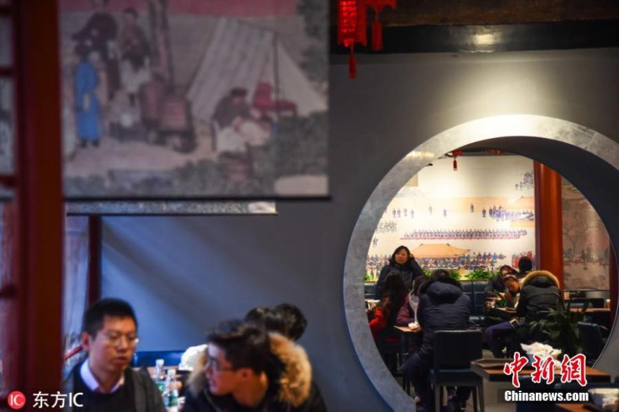 A view of Corner Tower Restaurant at the Palace Museum in Beijing. The emperor-themed hotpot eatery opened on February 5, the first day of the Lunar New Year. It features a menu in the form of an imperial edict, wall paintings, witty words related to royal life and choices like Empress Dowager Cixi\'s favorite chrysanthemum hotpot. It has proven so popular that the restaurant is fully booked in March. (Photo/IC)