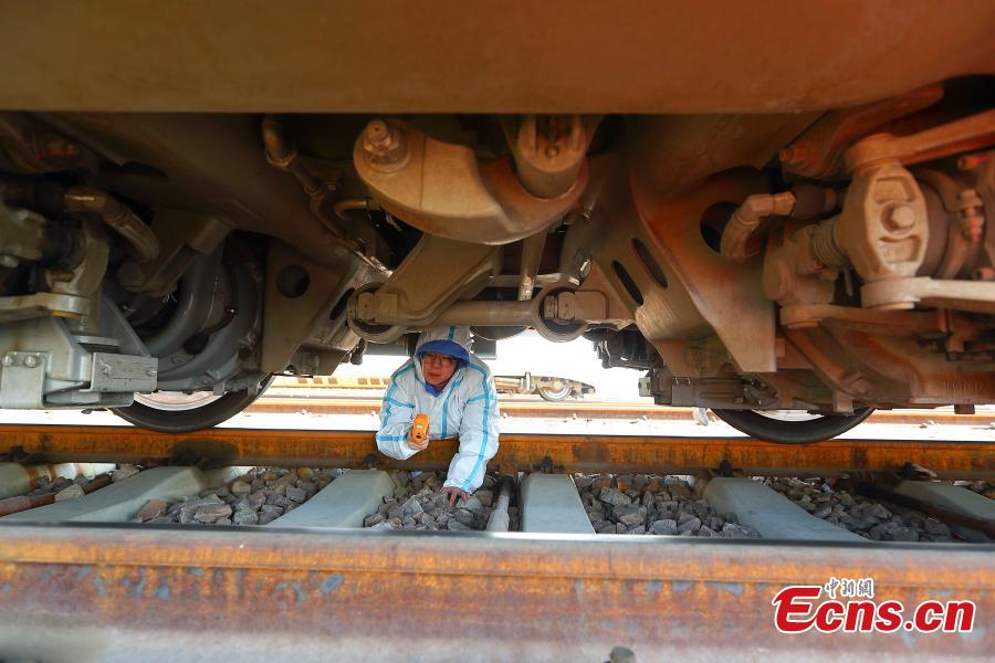 A technician participates in a drill simulating a mechanical failure on a high-speed train in Taiyuan, North China’s Shanxi Province, Feb. 21, 2019. The team at the high-speed train service station in Taiyuan, established on March 8, 2018, is comprised of 19 female technicians with an average age of 23 years, the first its kind in China. They are responsible for emergency responses related to high-speed trains heading to Beijing. (Photo: China News Service/Zhang Yun)
