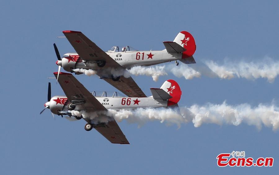 The Yakovlevs, a U.K. based aerobatic team flying Russian designed Yakovlev aircrafts, perform aerobatic maneuvers on the inaugural day of Aero India 2019 at Yelahanka air base in Bangalore, India, Wednesday, Feb. 20, 2019. Over 400 exhibitors from more than 20 countries and regions are participating in Aero India show this year. (Photo/Agencies)