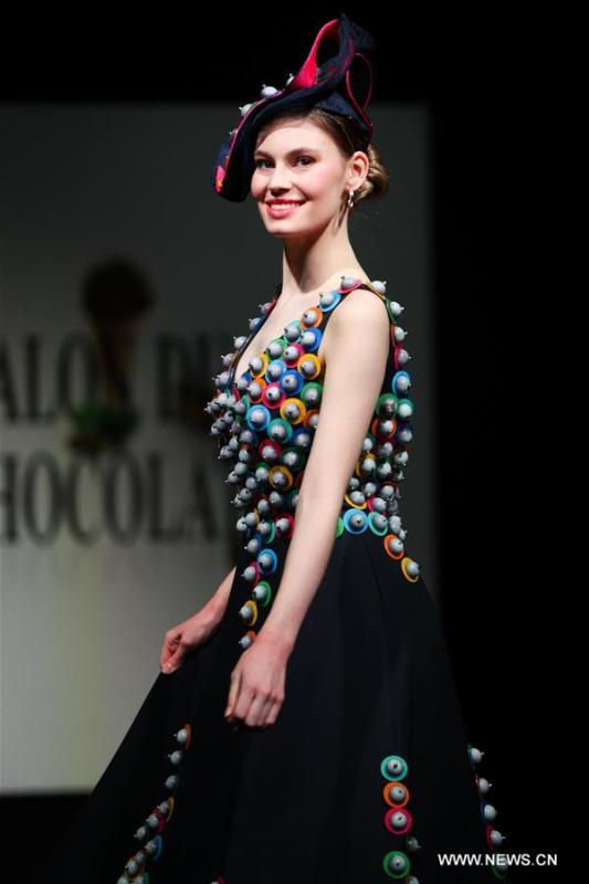 A model displays a chocolate dress during the opening show of the 6th Brussels Chocolate Salon in Brussels, Belgium, Feb. 21, 2019. The 6th Brussels Chocolate Salon (Salon du Chocolat Brussels) kicked off here on Thursday. In the following three days, 130 chocolatiers, pastry chefs, confectioners, designers and cocoa experts of international reputation in attendance will share and exhibit chocolate in all its delectable forms. (Xinhua/Zheng Huansong)