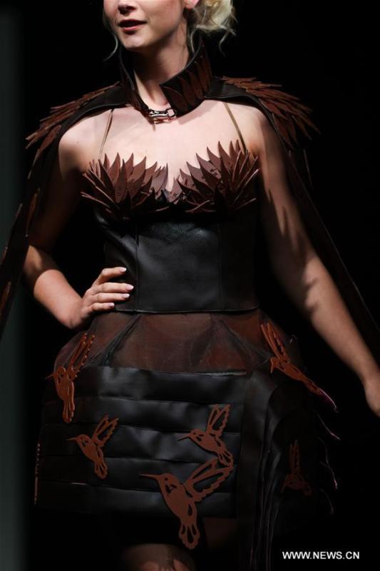 A model displays a chocolate dress during the opening show of the 6th Brussels Chocolate Salon in Brussels, Belgium, Feb. 21, 2019. The 6th Brussels Chocolate Salon (Salon du Chocolat Brussels) kicked off here on Thursday. In the following three days, 130 chocolatiers, pastry chefs, confectioners, designers and cocoa experts of international reputation in attendance will share and exhibit chocolate in all its delectable forms. (Xinhua/Zheng Huansong)