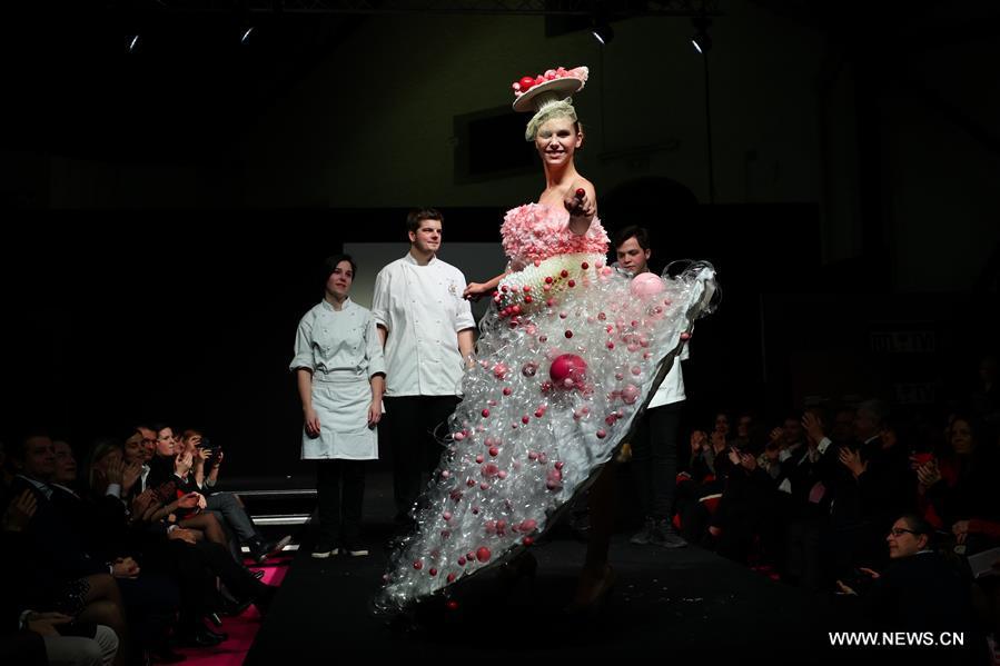 A model displays a chocolate dress during the opening show of the 6th Brussels Chocolate Salon in Brussels, Belgium, Feb. 21, 2019. The 6th Brussels Chocolate Salon (Salon du Chocolat Brussels) kicked off here on Thursday. In the following three days, 130 chocolatiers, pastry chefs, confectioners, designers and cocoa experts of international reputation in attendance will share and exhibit chocolate in all its delectable forms. (Xinhua/Zheng Huansong)