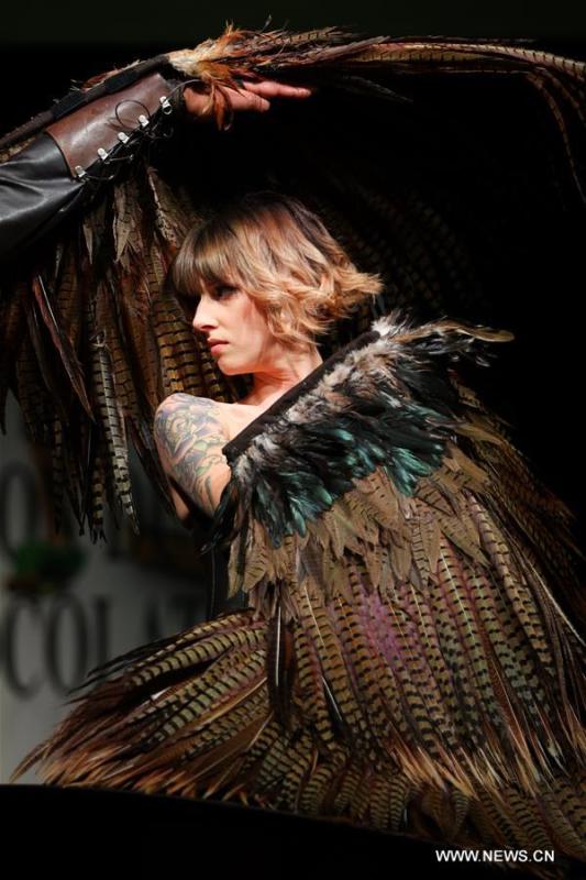 A model attends the opening show of the 6th Brussels Chocolate Salon in Brussels, Belgium, Feb. 21, 2019. The 6th Brussels Chocolate Salon (Salon du Chocolat Brussels) kicked off here on Thursday. In the following three days, 130 chocolatiers, pastry chefs, confectioners, designers and cocoa experts of international reputation in attendance will share and exhibit chocolate in all its delectable forms. (Xinhua/Zheng Huansong)