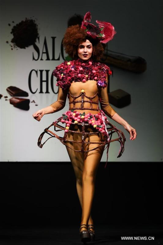 A model displays a chocolate dress during the opening show of the 6th Brussels Chocolate Salon in Brussels, Belgium, Feb. 21, 2019. The 6th Brussels Chocolate Salon (Salon du Chocolat Brussels) kicked off here on Thursday. In the following three days, 130 chocolatiers, pastry chefs, confectioners, designers and cocoa experts of international reputation in attendance will share and exhibit chocolate in all its delectable forms. (Xinhua/Zheng Huansong)