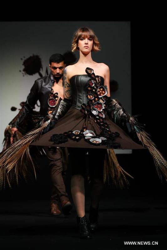 A model displays a chocolate dress during the opening show of the 6th Brussels Chocolate Salon in Brussels, Belgium, Feb. 21, 2019. The 6th Brussels Chocolate Salon (Salon du Chocolat Brussels) kicked off here on Thursday. In the following three days, 130 chocolatiers, pastry chefs, confectioners, designers and cocoa experts of international reputation in attendance will share and exhibit chocolate in all its delectable forms. (Xinhua/Zheng Huansong)