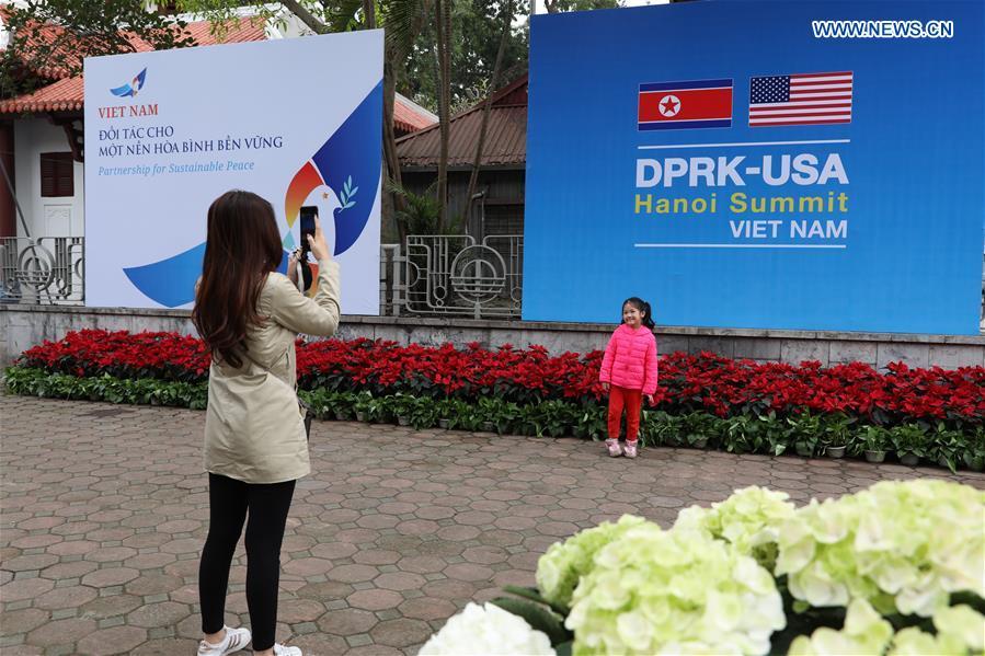 A child poses for photos outside the International Media Center for the second summit between the Democratic People\'s Republic of Korea (DPRK) and the United States in Hanoi, Vietnam, on Feb. 24, 2019. The second DPRK-U.S. summit is scheduled to be held in Hanoi on Feb. 27-28. (Xinhua/Wang Di)