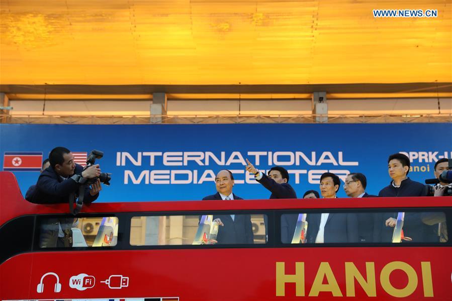 Vietnamese Prime Minister Nguyen Xuan Phuc (2nd L) visits the International Media Center for the second summit between the Democratic People\'s Republic of Korea (DPRK) and the United States in Hanoi, Vietnam, on Feb. 24, 2019. The second DPRK-U.S. summit is scheduled to be held in Hanoi on Feb. 27-28. (Xinhua/Wang Di)