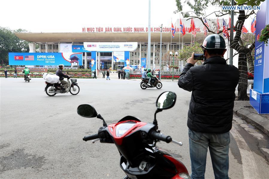 A man takes photos of the International Media Center for the second summit between the Democratic People\'s Republic of Korea (DPRK) and the United States in Hanoi, Vietnam, on Feb. 24, 2019. The second DPRK-U.S. summit is scheduled to be held in Hanoi on Feb. 27-28. (Xinhua/Wang Di)