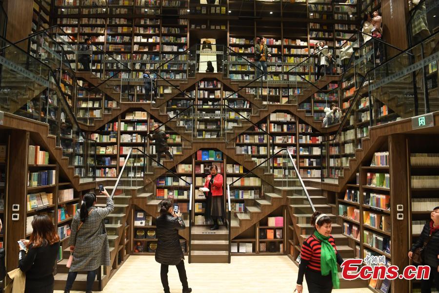 A view of the full bookshelves at a bookstore in Chongqing southwestern China, Feb. 25, 2019.   The newly opened bookstore in Chongqing southwestern China has attracted over 200,000 visitors since it opened on Jan. 25.  The store quickly gained attention for its mind-boggling interior design.  (Photo/China News Service)