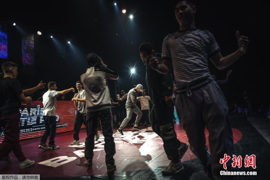Dancers execute backflips and freezes, gyros and headspins with gravity-defying agility in front of an adoring audience at Battle Pro in Paris, France, Feb. 23, 2019. Organizers of Paris 2024 have proposed that breakdancing should be included as a new sport in the Olympic program. (Photo/Agencies)