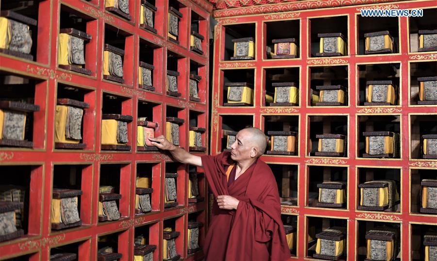 A monk of the Potala Palace arranges documents in Lhasa, capital of southwest China\'s Tibet Autonomous Region, Nov. 15, 2018. The Chinese government will invest 300 million yuan (44.9 million U.S. dollars) in the next 10 years in its greatest efforts of protection and utilization of ancient documents in the Potala Palace, a World Heritage site in Lhasa, southwest China\'s Tibet Autonomous Region, according to the management office of the Potala Palace. (Xinhua/Purbu Zhaxi)

The Chinese government will invest 300 million yuan (44.9 million U.S. dollars) in the next 10 years in its greatest efforts of protection and utilization of ancient documents in the Potala Palace, a World Heritage site in Lhasa, southwest China\'s Tibet Autonomous Region.

At present, a total of nearly 40,000 books of precious ancient documents in Chinese, Tibetan, Manchu, Mongolian and Sanskrit are preserved in the Potala Palace, said the management office of the Potala Palace Monday.

\