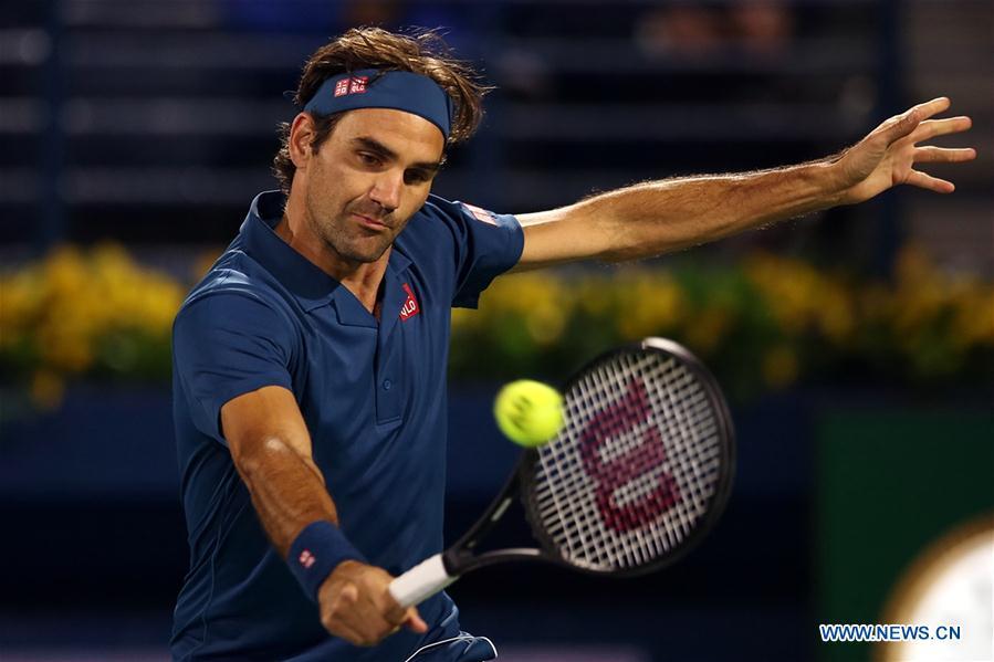 Roger Federer of Switzerland hits a return during the singles first round match between Roger Federer of Switzerland and Philipp Kohlschreiber of Germany at the ATP Dubai Duty Free Tennis Championships 2019 in Dubai, the United Arab Emirates, Feb. 25, 2019. Roger Federer won 2-1. (Xinhua/Mahmoud Khaled)