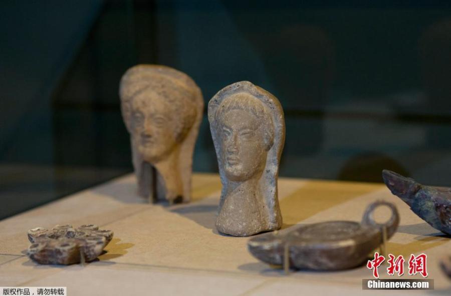 Anthropomorphic heads rescued from the ashes of last year\'s fire that swept through the National Museum are displayed at the Bank of Brazil Cultural Center in Rio de Janeiro on Feb 25, 2019. The exhibit is titled \