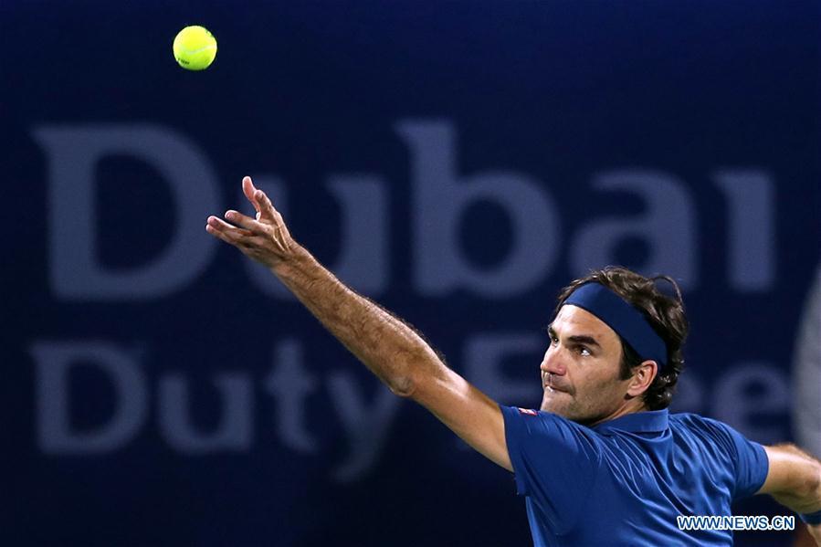 Roger Federer of Switzerland serves during the singles first round match between Roger Federer of Switzerland and Philipp Kohlschreiber of Germany at the ATP Dubai Duty Free Tennis Championships 2019 in Dubai, the United Arab Emirates, Feb. 25, 2019. Roger Federer won 2-1. (Xinhua/Mahmoud Khaled)