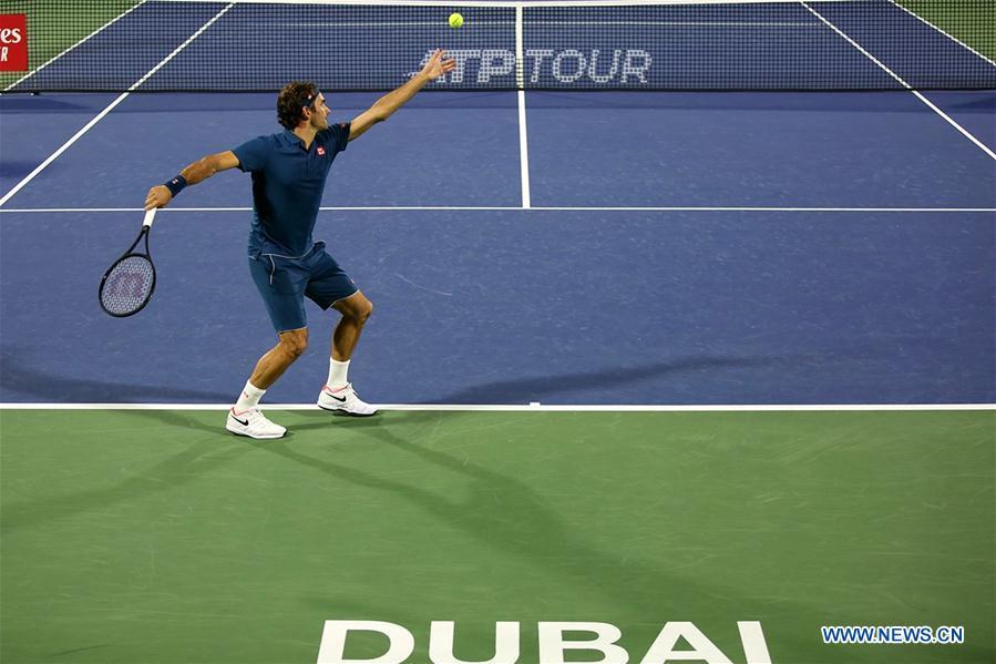 Roger Federer of Switzerland serves during the singles first round match between Roger Federer of Switzerland and Philipp Kohlschreiber of Germany at the ATP Dubai Duty Free Tennis Championships 2019 in Dubai, the United Arab Emirates, Feb. 25, 2019. Roger Federer won 2-1. (Xinhua/Mahmoud Khaled)