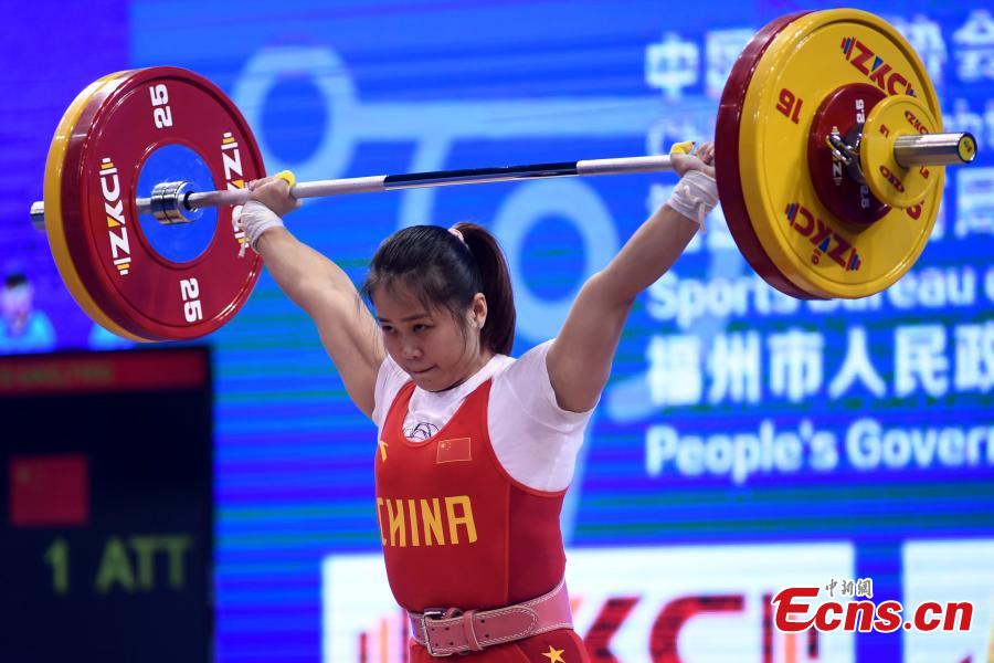 Deng Wei competes during the women\'s weightlifting 64kg event at 2019 IWF World Cup & Qualification Event For 2020 Tokyo Olympic Games in Fuzhou, southeast China\'s Fujian Province, Feb. 25, 2019. (Photo: China News Service/Zhang Bin)