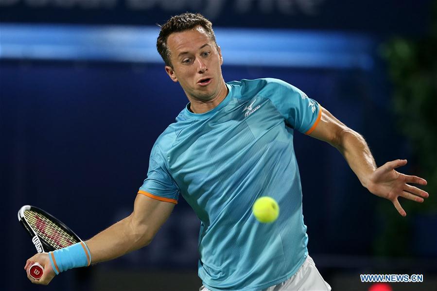 Philipp Kohlschreiber of Germany hits a return during the singles first round match between Roger Federer of Switzerland and Philipp Kohlschreiber of Germany at the ATP Dubai Duty Free Tennis Championships 2019 in Dubai, the United Arab Emirates, Feb. 25, 2019. Roger Federer won 2-1. (Xinhua/Mahmoud Khaled)