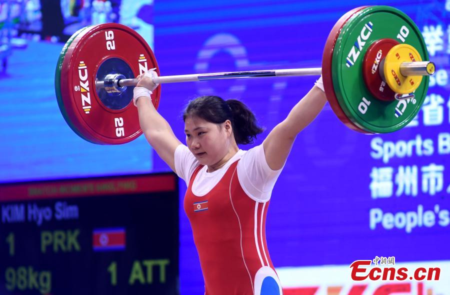 Kim Hyo Sim of the Democratic People\'s Republic of Korea (DPRK) competes during the women\'s weightlifting 64kg event at 2019 IWF World Cup & Qualification Event For 2020 Tokyo Olympic Games in Fuzhou, southeast China\'s Fujian Province, Feb. 25, 2019. (Photo: China News Service/Zhang Bin)