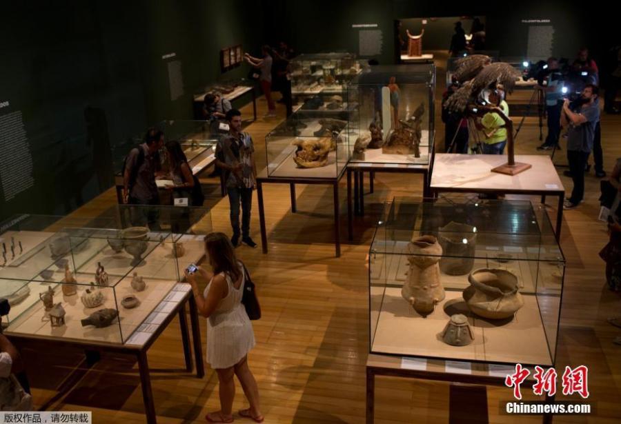 Journalists see archeological pieces rescued from the ashes of last year\'s fire that swept through the National Museum in Brazil, Feb. 25, 2019. The exhibit is titled \