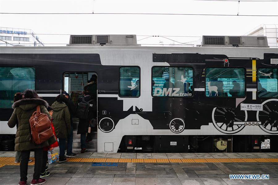 Passengers board a DMZ train at Seoul Railway Station in Seoul, South Korea, Feb. 20, 2019. Created in 1953 when the three-year Korean War ended with armistice, the Demilitarized Zone (DMZ) has long been a symbol of both confrontation and peace as tensions or rapprochement across the inter-Korean border can be felt firsthand in the 250-km-long strip of no-man\'s land. The DMZ Train departed Seoul Station for Dorasan Station, the northernmost station of the ROK just about 50 km north of Seoul and only 700 meters south of the southern boundary of the 4-km-wide DMZ. (Xinhua/Wang Jingqiang)