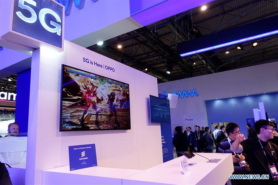 Chinese company OPPO presents its live 5G real-time multiplayer cloud gaming at Mobile World Congress (MWC 2019) in Barcelona, Spain, Feb. 25, 2019. The four-day MWC 2019 opened its door on Monday, which presents the newest 5G products of the high-tech giants from all around the world. (Xinhua/Guo Qiuda)