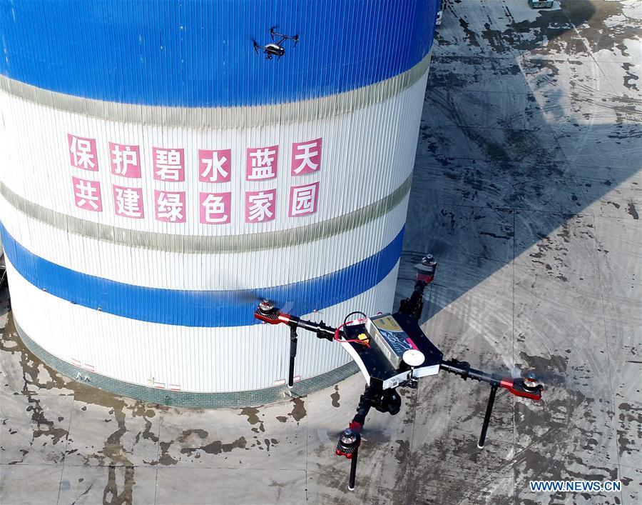 Aerial photo shows a drone of Weixian branch of environmental protection agency of Handan City checking the air quality over a company at Weixian County, north China\'s Hebei Province, Nov. 1, 2018. As \