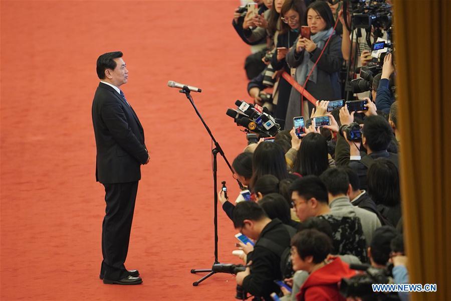 Feng Zhenglin, head of the Civil Aviation Administration of China (CAAC), receives an interview after the opening meeting of the second session of the 13th National Committee of the Chinese People\'s Political Consultative Conference (CPPCC) at the Great Hall of the People in Beijing, capital of China, March 3, 2019. (Xinhua/Xing Guangli)