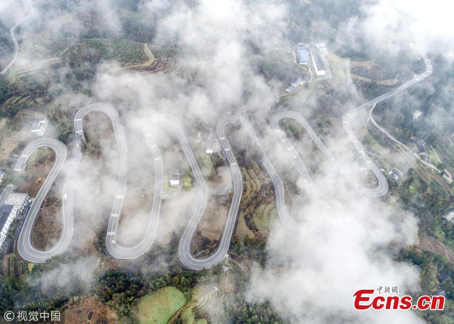 A winding mountain road, which has become a tourist attraction for its ten bends, is shrouded in mist in Taiyanghe Township, Enshi Tujia and Miao Autonomous Prefecture, Hubei Province, March 3, 2019. (Photo/VCG)