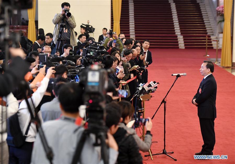 Li Ganjie, minister of ecology and environment, receives an interview after the opening meeting of the second session of the 13th National Committee of the Chinese People\'s Political Consultative Conference (CPPCC) at the Great Hall of the People in Beijing, capital of China, March 3, 2019. (Xinhua/Shen Bohan)