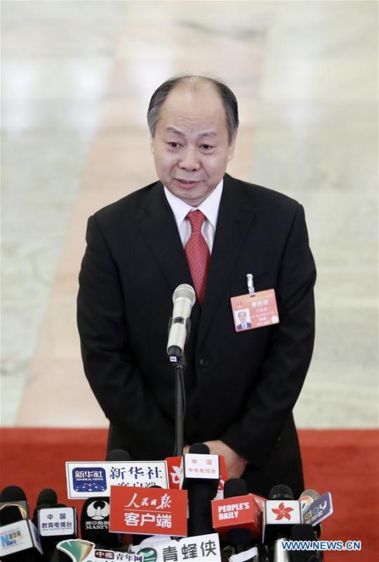 Wang Xiaotao, head of China International Development Cooperation Agency, receives an interview after the opening meeting of the second session of the 13th National Committee of the Chinese People\'s Political Consultative Conference (CPPCC) at the Great Hall of the People in Beijing, capital of China, March 3, 2019. (Xinhua/Cai Yang)
