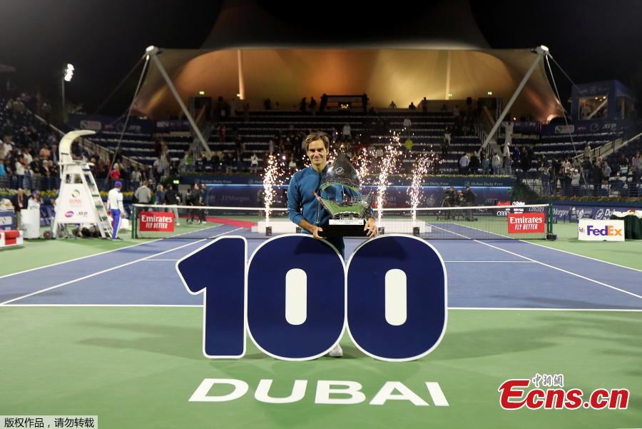 Roger Federer of Switzerland holds his trophy after winning the final match at the Dubai Duty Free Tennis Championship against Stefanos Tsitsipas of Greece, in Dubai, United Arab Emirates, March 2, 2019. Roger Federer claimed the 100th ATP title of his career by beating 20-year-old Greek Stefanos Tsitsipas 6-4 6-4. The 20-times Grand Slam champion became the second man in the Open Era to win 100 titles, after American Jimmy Connors who won 109. (Photo/Agencies)