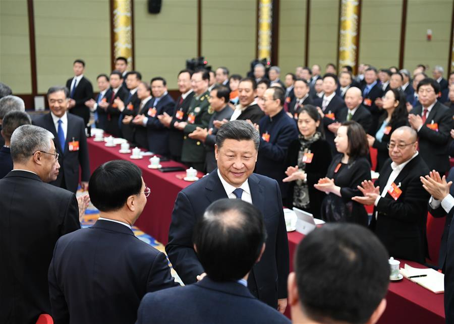 Chinese President Xi Jinping, also general secretary of the Communist Party of China (CPC) Central Committee and chairman of the Central Military Commission, visits political advisors from the sectors of culture and art, and social sciences who are attending the second session of the 13th National Committee of the Chinese People\'s Political Consultative Conference (CPPCC) in Beijing, capital of China, March 4, 2019. Xi joined them in a joint panel discussion and heard their opinions and suggestions. Wang Yang, a member of the Standing Committee of the Political Bureau of the CPC Central Committee and chairman of the CPPCC National Committee, also attended the discussion. (Xinhua/Xie Huanchi)