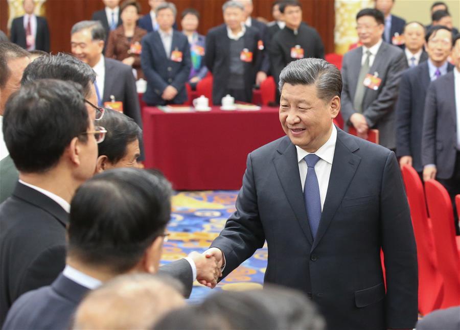 Chinese President Xi Jinping, also general secretary of the Communist Party of China (CPC) Central Committee and chairman of the Central Military Commission, visits political advisors from the sectors of culture and art, and social sciences who are attending the second session of the 13th National Committee of the Chinese People\'s Political Consultative Conference (CPPCC) in Beijing, capital of China, March 4, 2019. Xi joined them in a joint panel discussion and heard their opinions and suggestions. Wang Yang, a member of the Standing Committee of the Political Bureau of the CPC Central Committee and chairman of the CPPCC National Committee, also attended the discussion. (Xinhua/Yao Dawei)