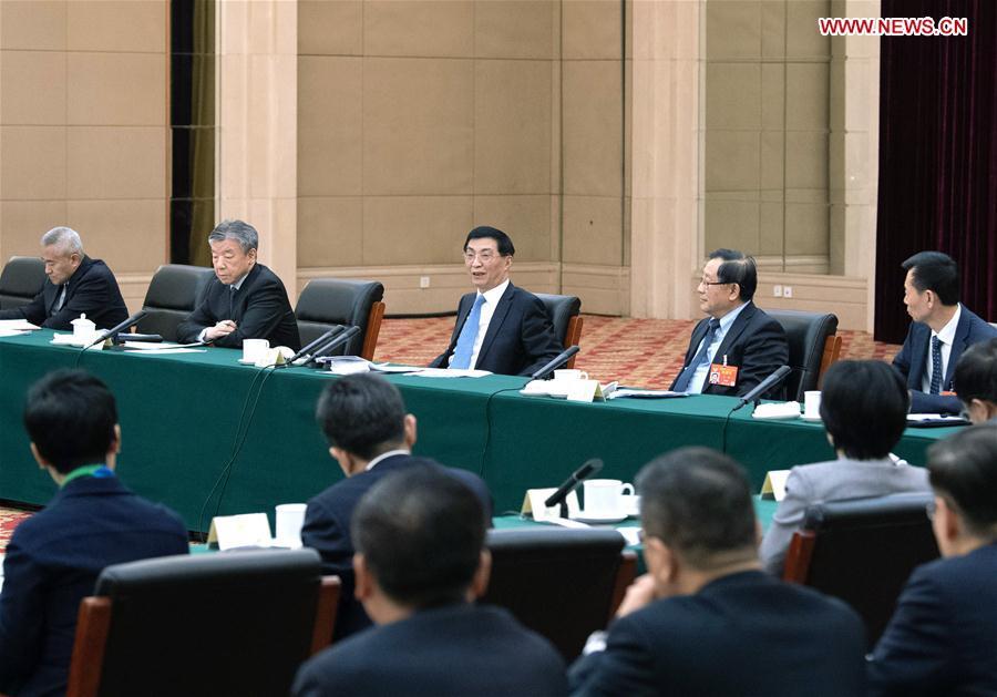 Wang Huning, a member of the Standing Committee of the Political Bureau of the Communist Party of China (CPC) Central Committee and a member of the Secretariat of the CPC Central Committee, joins a panel discussion with political advisors from the sectors of social welfare and security and specially invited political advisors at the second session of the 13th National Committee of the Chinese People\'s Political Consultative Conference (CPPCC) in Beijing, capital of China, March 4, 2019. (Xinhua/Shen Hong)
