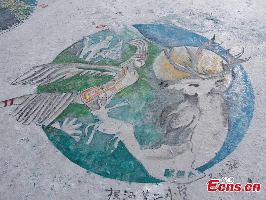 Paintings adorn the ground during an ice and snow festival in the Aoluguya Ewenki ethnic township in the Inner Mongolia Autonomous Region, March 5, 2019. The paintings depict the customs and natural landscape of the township, home to China\'s only reindeer-herding tribe. (Photo: China News Service/Zheng Wei and Deng Hongpeng)