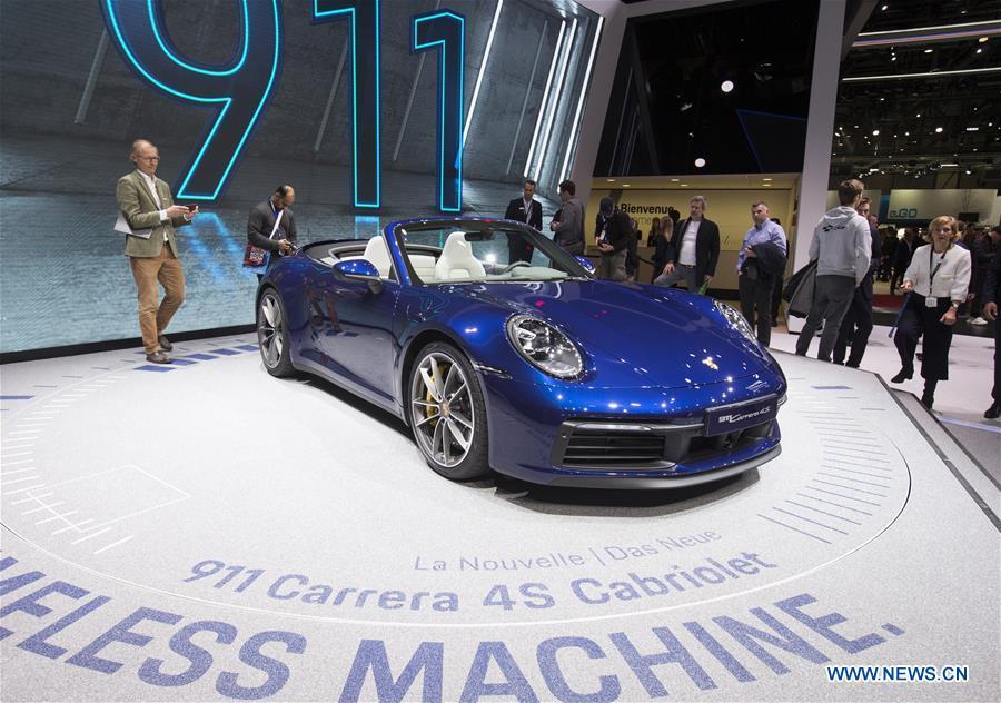 A Porsche 911 Carrera 4S Cabriolet is seen on the first press day of the 89th Geneva International Motor Show in Geneva, Switzerland, March 5, 2019. Featuring about 220 world exhibitors, the 89th Geneva International Motor Show will be opened to the public from March 7 to 17. (Xinhua/Xu Jinquan)