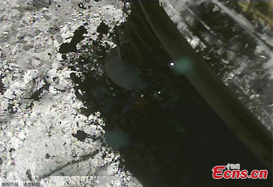 Japan\'s space agency released on March 6, 2019 an incredible video showing that its Hayabusa 2 probe dipped down, close to the surface of the asteroid known as Ryugu, fired a projectile at its surface, snatched some sample material, and then gently drifted back into its original position. (Photo/Agencies)