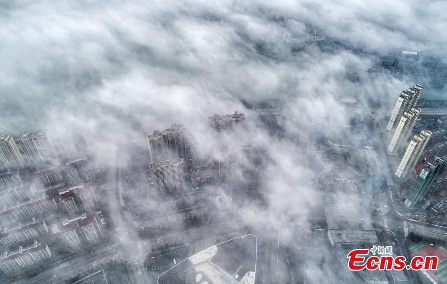 A drone photo taken on March 5, 2019 shows the skyline of Wuning County in Jiangxi Province under heavy fog. (Photo: China News Service/Luo Xingang)